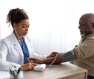  Doctor checking measuring pressure on patient's hand pulse