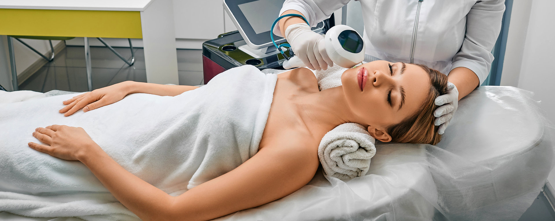 female relaxing while dermatologist is fixing her face